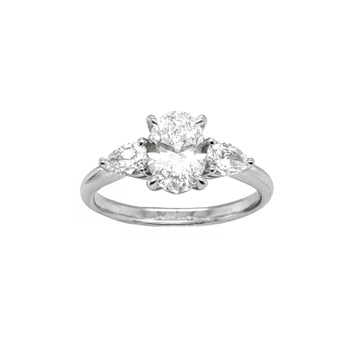 oval and pear trilogy diamond engagement ring