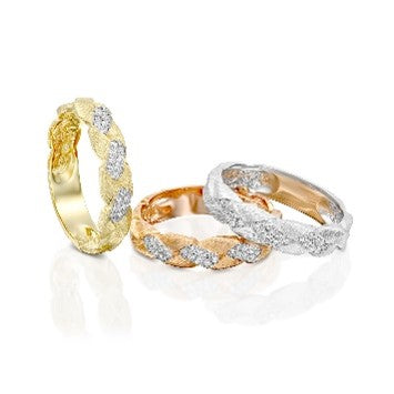Textured gold ring with round brilliant diamond accents