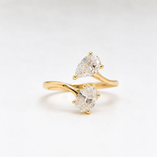 Pear and oval cut lab grown diamond ring close up