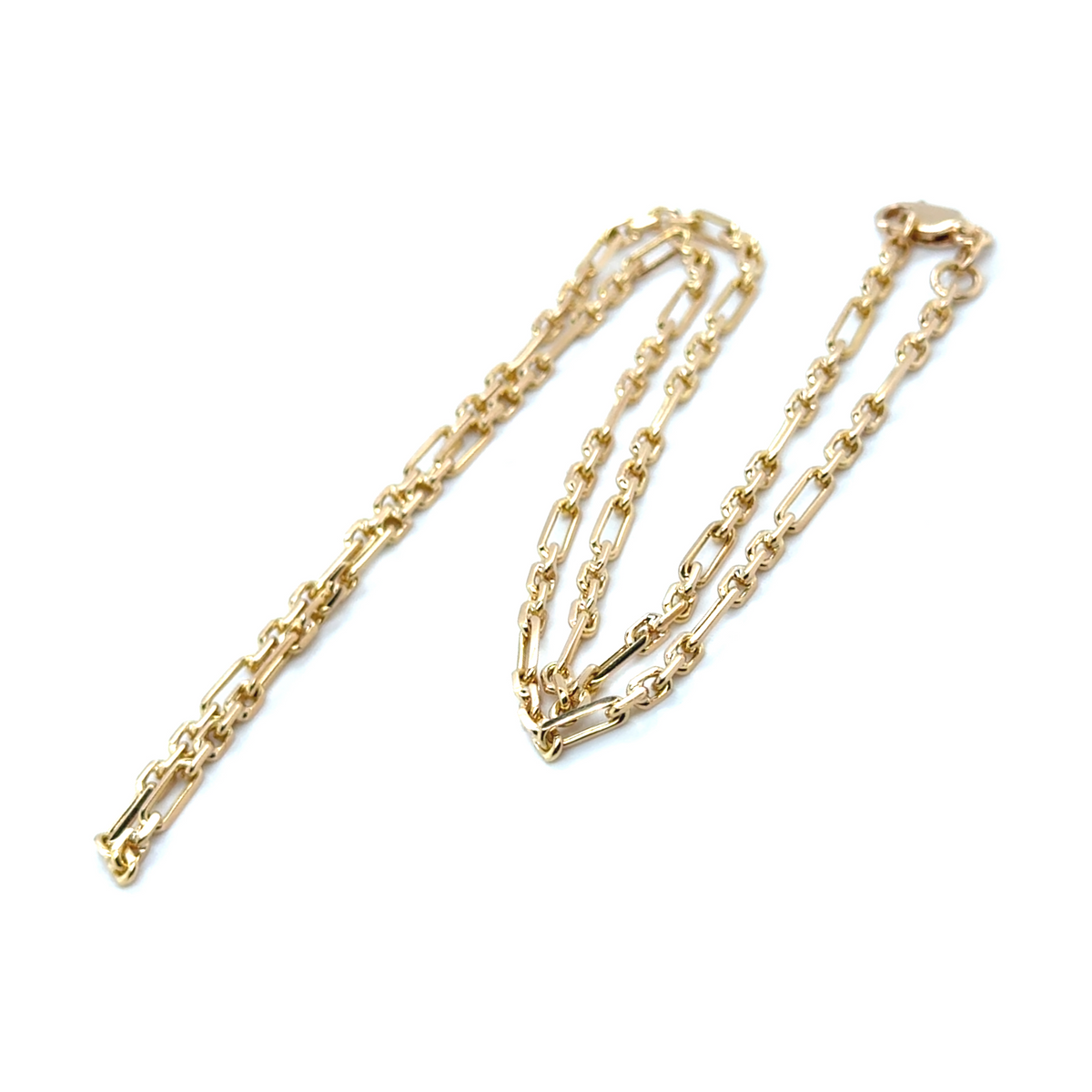Gold Figaro chain suitable for layering or wearing alone