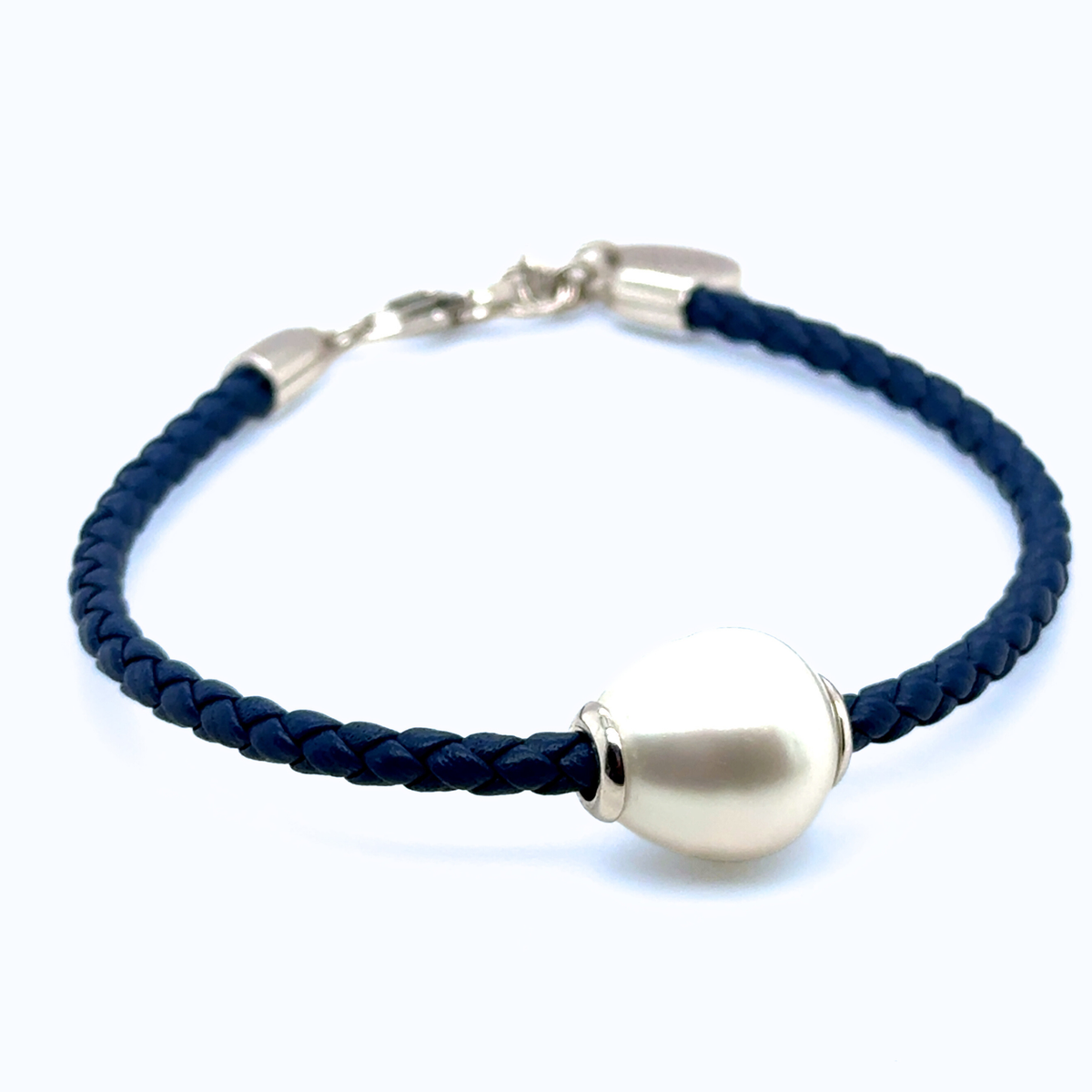 Close-up of Naya Pearl Leather Bracelet featuring 12mm white South Sea Pearl and silver clasp