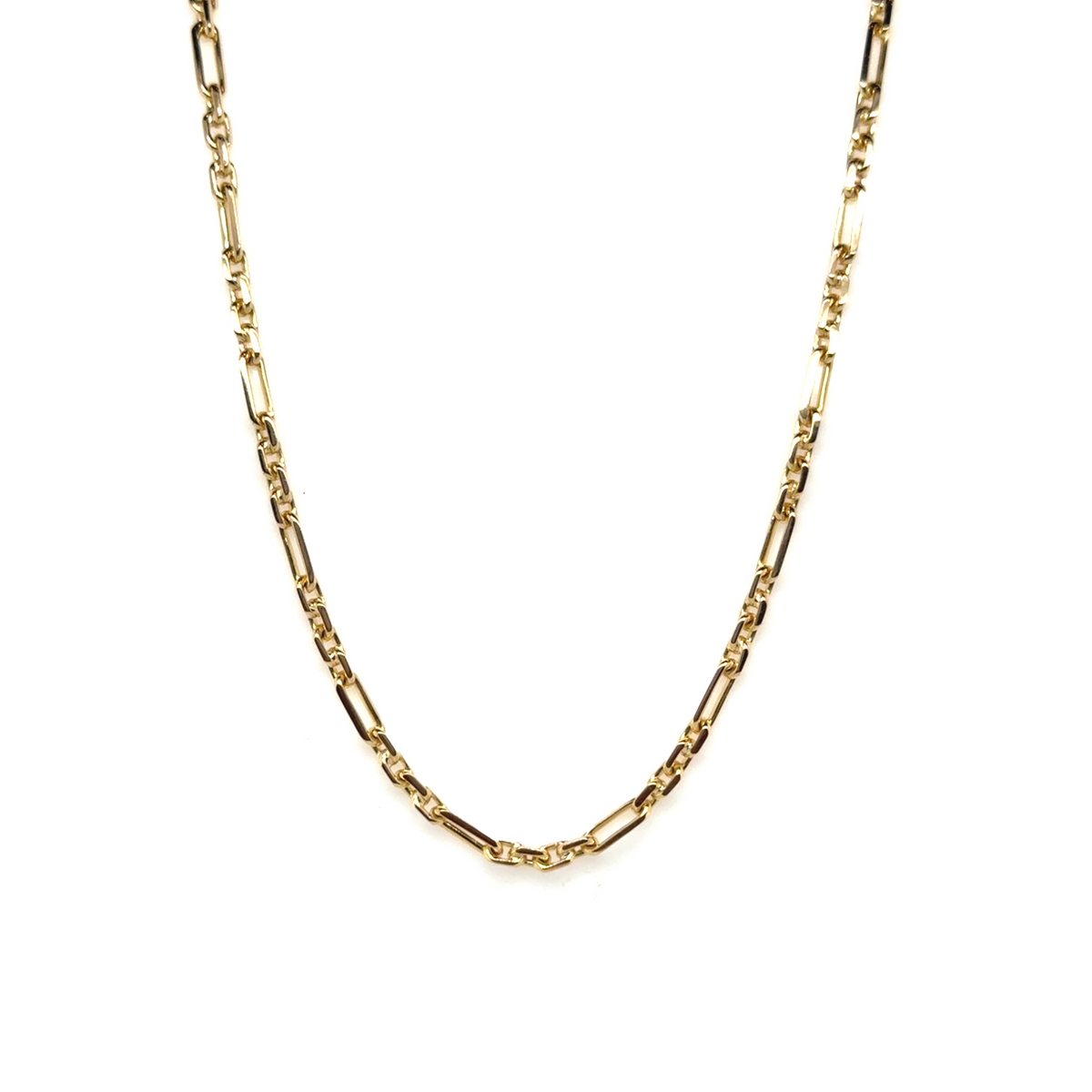 Australian-made Figaro chain in yellow gold on natural stone