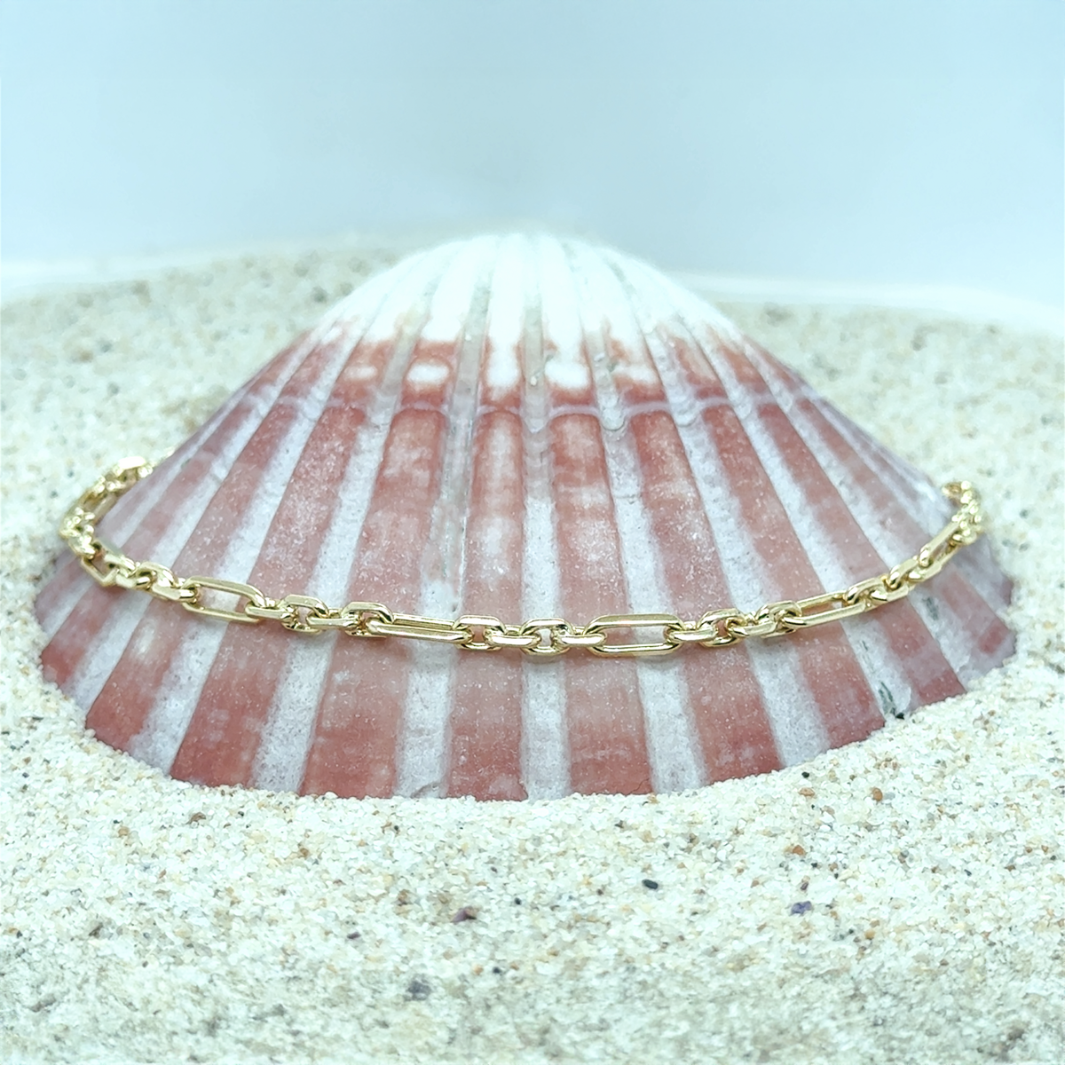 Gold Figaro chain suitable for layering or wearing alone