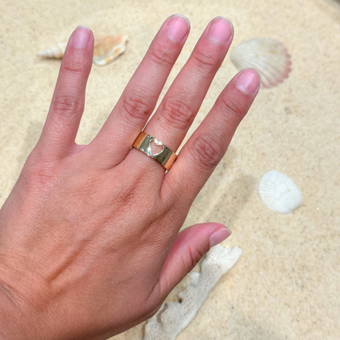 Matt & Chloe custom-made gold heart ring worn on hand, personalised symbolic jewellery.