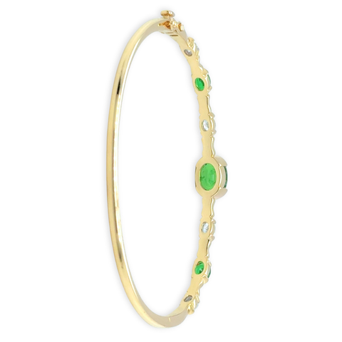 Tsavorite and diamond bangle in 14k yellow gold