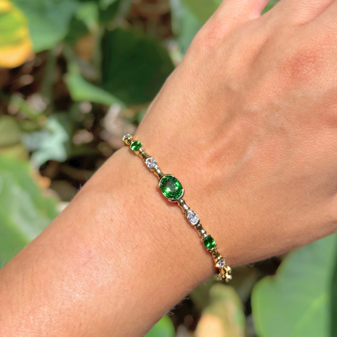 Oval tsavorite garnet bangle with diamonds