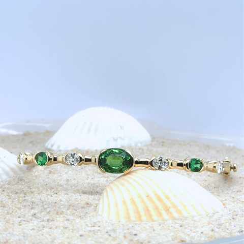 Oval tsavorite garnet bangle with diamonds