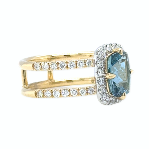 Side view of Santa Maria aquamarine ring with diamond pavé shoulders in yellow gold.