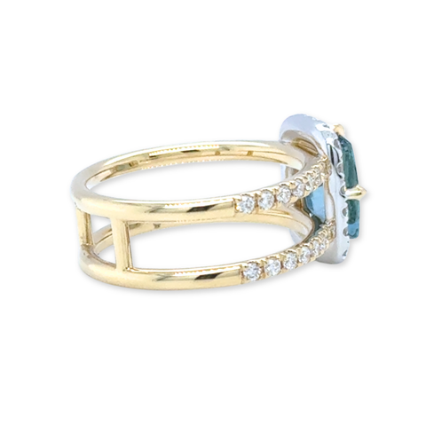 Side view of Santa Maria aquamarine ring with diamond pavé shoulders in yellow gold.