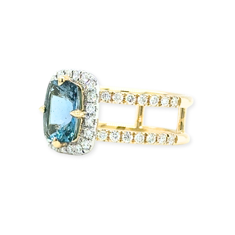 Side view of Santa Maria aquamarine ring with diamond pavé shoulders in yellow gold.