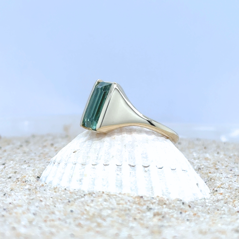 Minimalist blue tourmaline ring on hand