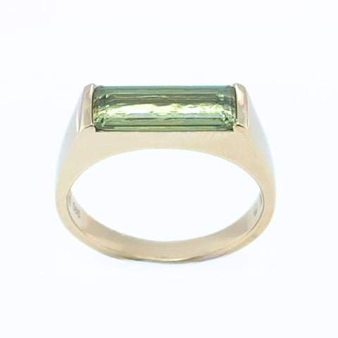 Tourmaline ring highlighting elongated emerald cut design