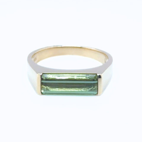 Emerald cut green tourmaline ring set in 14kt yellow gold