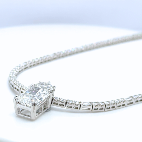 Platinum diamond enhancer pendant attached to tennis necklace