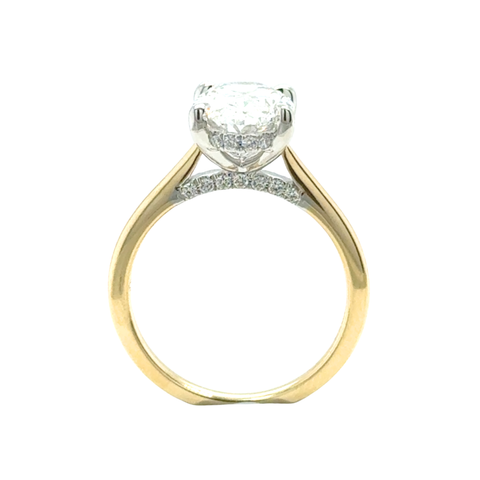 Oval diamond ring with platinum setting and yellow gold band