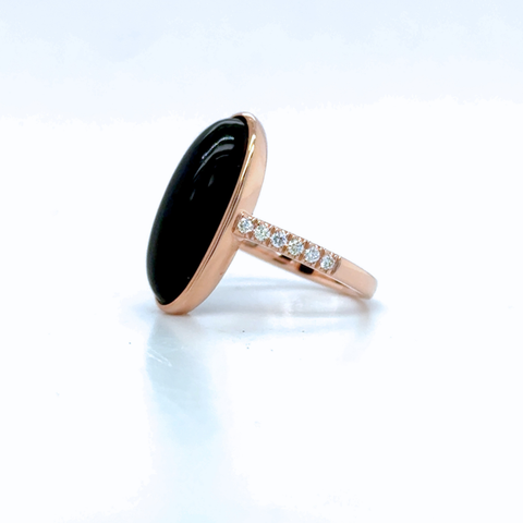 oval black onyx ring with diamond shoulder detail