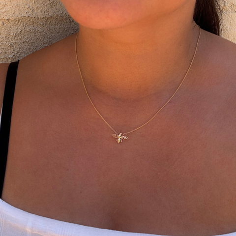 Symbolic bee necklace layered on collarbone – fine jewellery