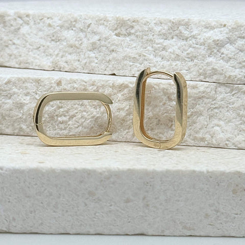 Close-up of 9kt yellow gold huggie earrings 2.3mm profile