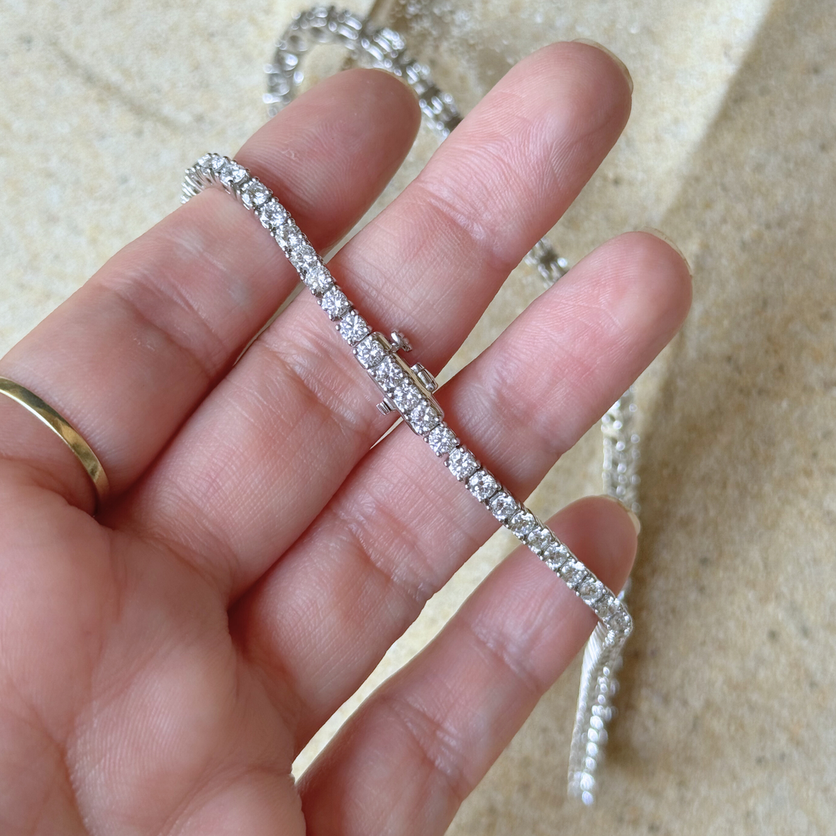 diamond tennis necklace worn close up