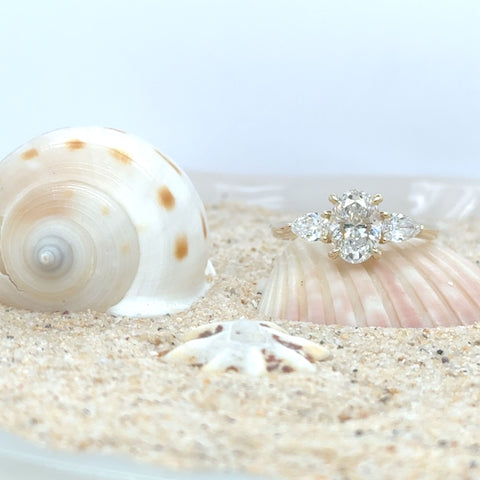 oval and pear trilogy diamond engagement ring2