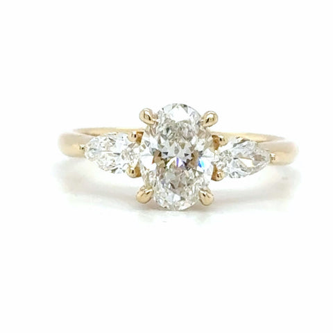 oval and pear trilogy diamond engagement ring