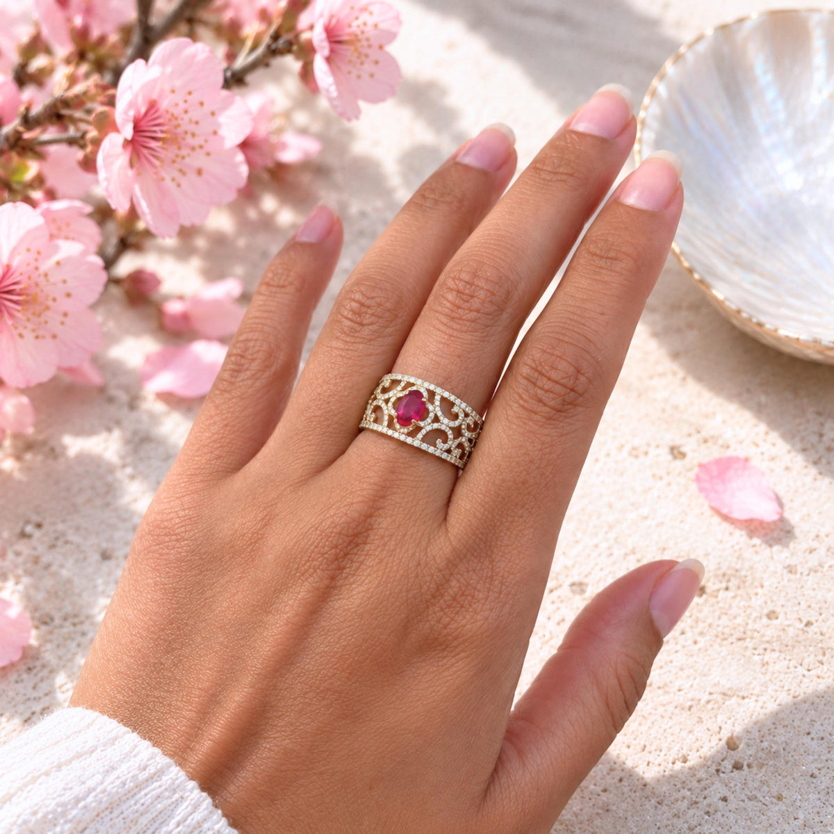 Aisha oval ruby and diamond statement ring in 18ct yellow gold worn on hand