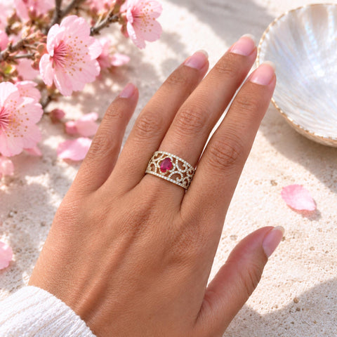 Aisha oval ruby and diamond statement ring in 18ct yellow gold worn on hand