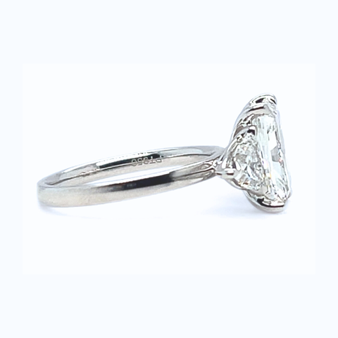 Platinum trilogy engagement ring with radiant centre diamond and trilliant shoulder stones