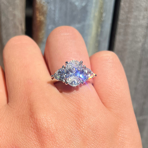 Trilogy Diamond ring on a finger 