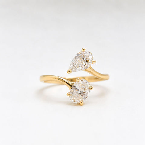 Pear and oval cut lab grown diamond ring close up