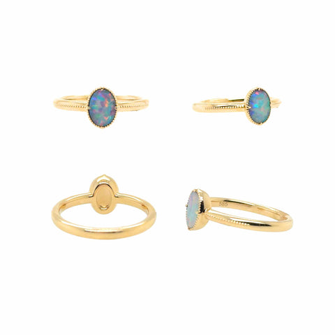 Oval Australian opal ring worn in 14kt yellow gold