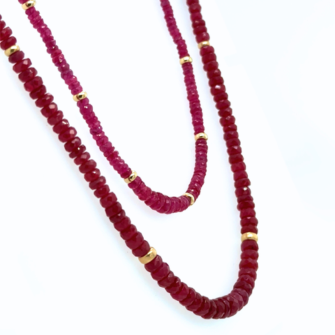 Mozambique and Burmese ruby strand necklace 70ct with 14kt gold rondels, double-loop display on white background