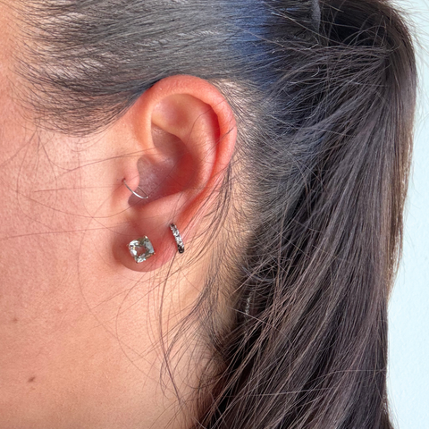 Green amethyst yellow gold stud earrings worn with minimal style, feminine coastal jewellery aesthetic