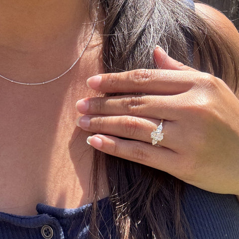 three stone engagement ring worn on hand