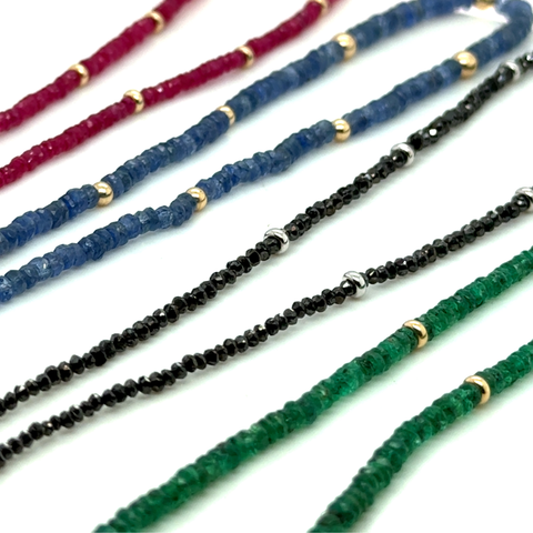 Gemstone strand collection including black diamonds, Mozambique ruby, Burmese ruby and sapphire
