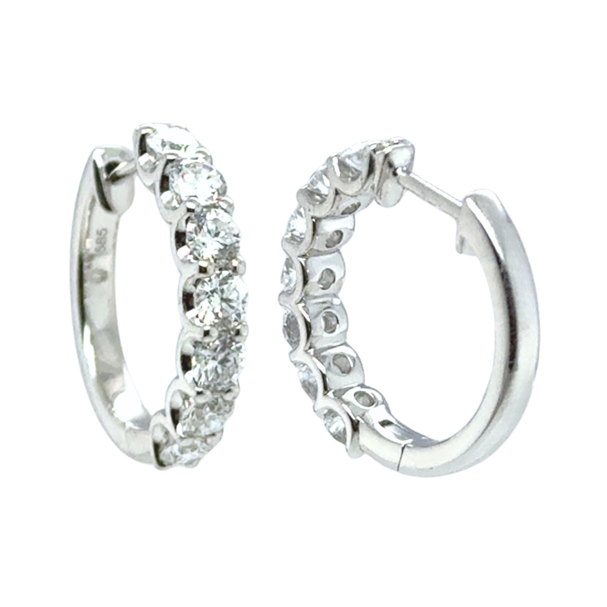Tory huggie earrings with round brilliant lab grown diamonds set in 14kt white gold.