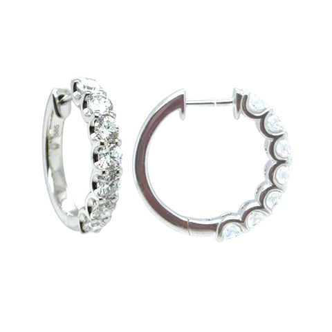 Tory huggie earrings with round brilliant lab grown diamonds set in 14kt white gold.