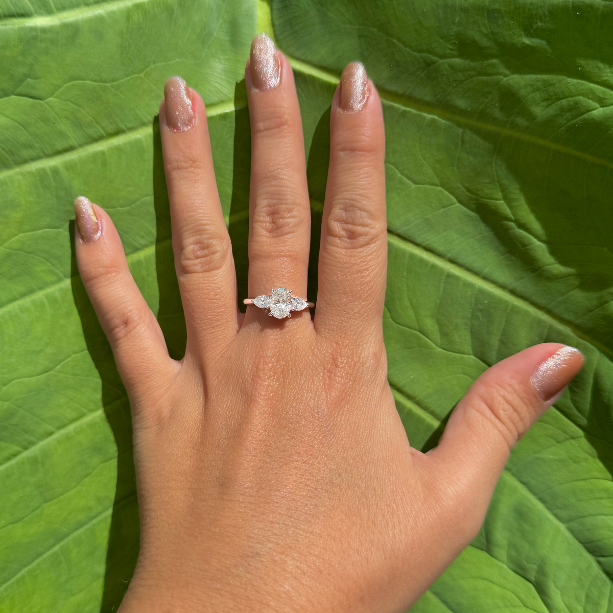 three stone diamond ring oval centre pear sides