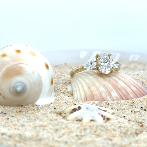 three stone engagement ring worn on hand