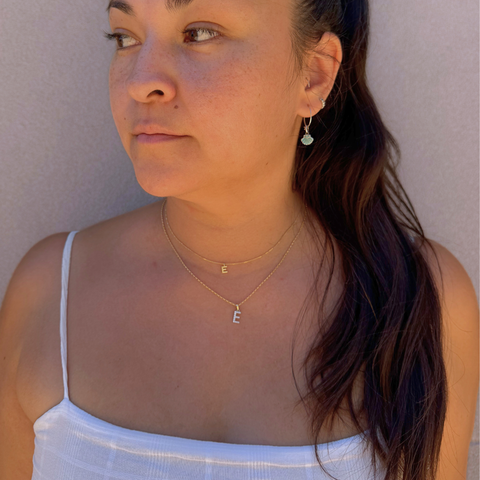 Luxury diamond initial necklace on model