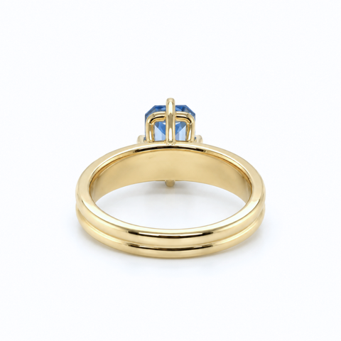 Emerald-cut Ceylon sapphire ring worn on hand in Sydney