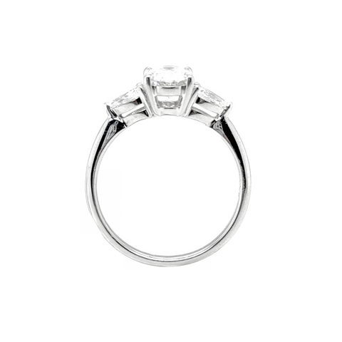 oval diamond ring with pear side stones

