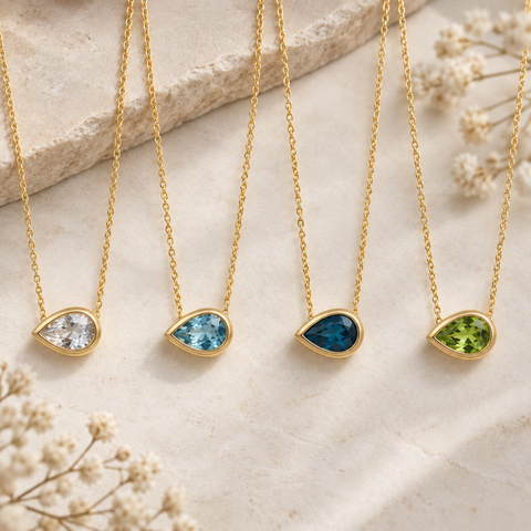 Pear Aroha necklaces with diamond aquamarine topaz and peridot