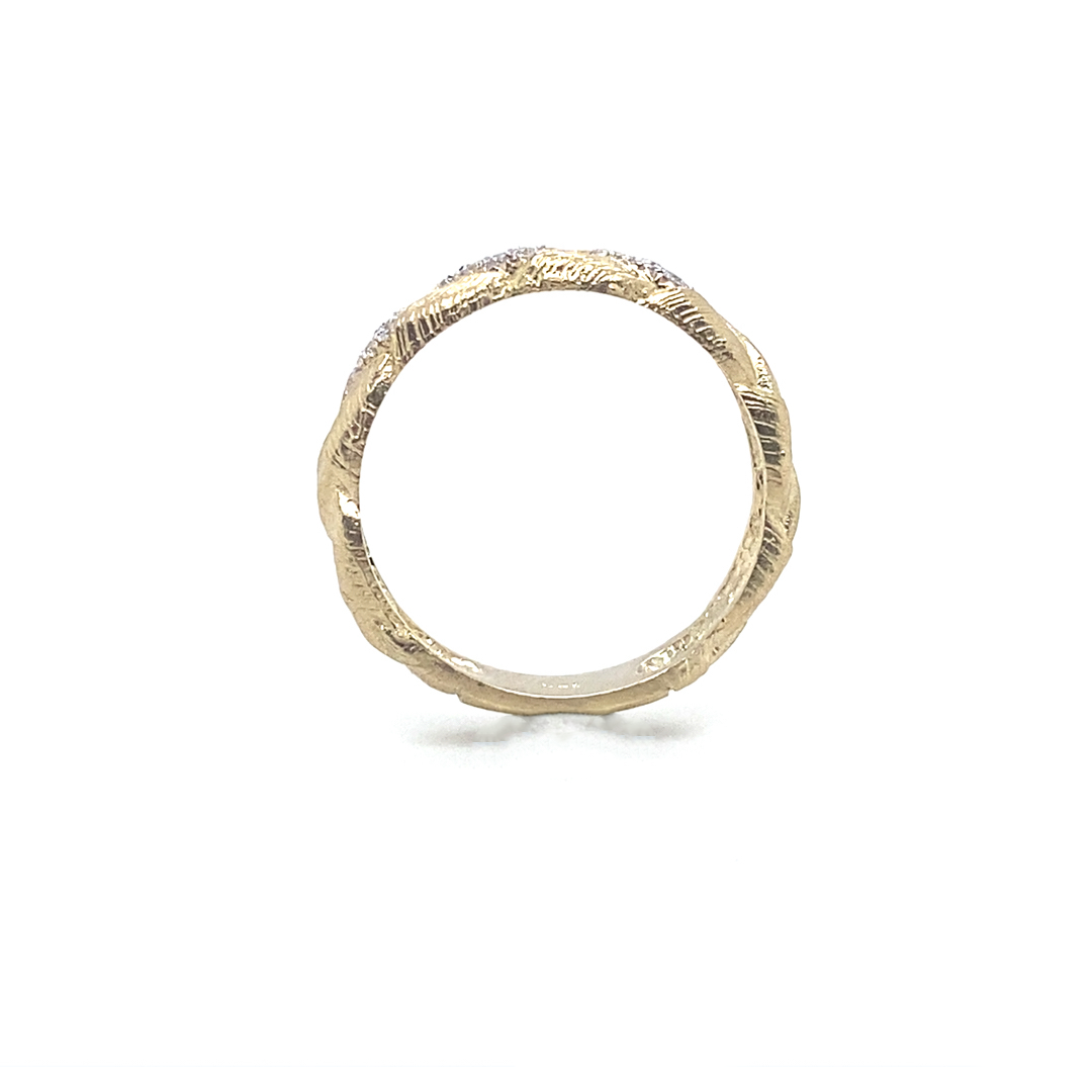 Textured gold ring with round brilliant diamond accents