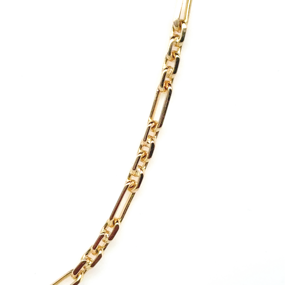 Figaro link gold chain laid flat showing classic link pattern