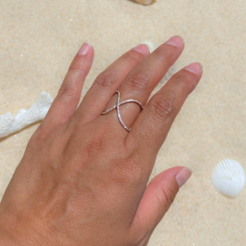 Diamond infinity ring in 18kt yellow gold worn on hand, minimalist modern design