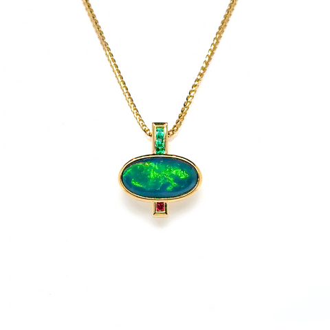 18kt yellow gold opal pendant worn on neckline