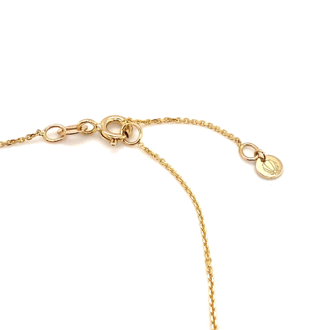 Close-up of 9kt gold birthstone bracelet featuring round gemstone in minimalist setting.